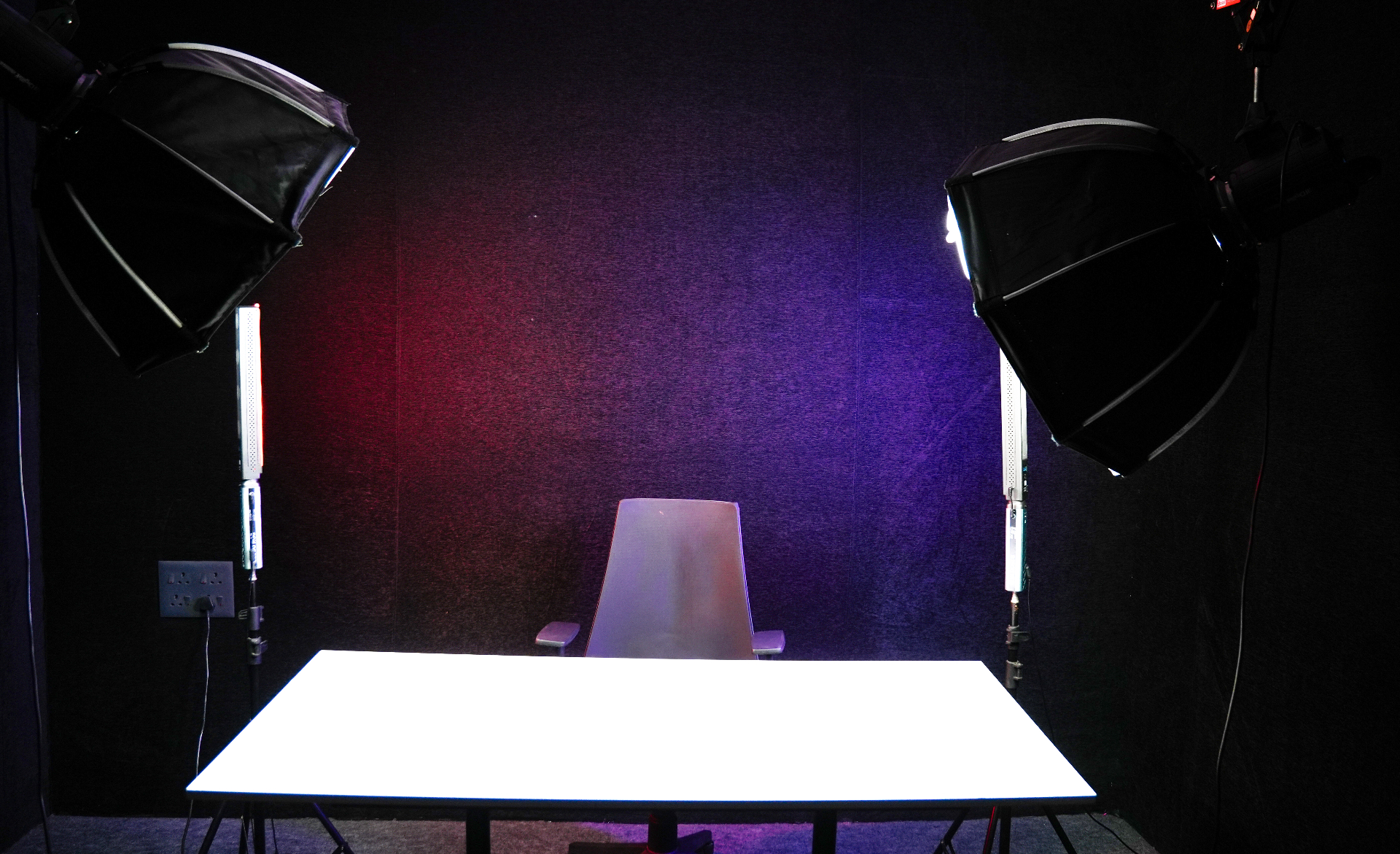 Regular content creation setup with desk, chair and lighting in the studio